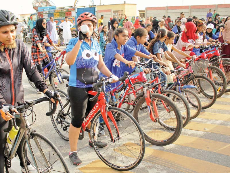 scores of girls aged between 10 and 25 years participated in a cycle race at sea view to commemorate the international day of the girl child photos athar khan express