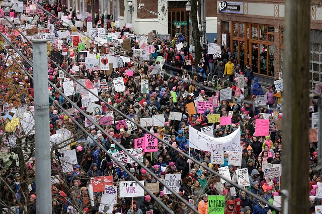 in this file photo taken on january 20 2018 people participate in women 039 s march 2 0 one year after women worldwide marched for women 039 s rights and to protest us president donald trump 039 s inauguration in seattle washington   energized by a bitter fight over a us supreme court justice nominee thousands of women were expected to march saturday in chicago and cast early midterm election ballots against the quot anti woman agenda quot of president donald trump 039 s administration the protest organized by women 039 s march chicago was a sign of the political fallout from the partisan fight to confirm trump 039 s nominee brett kavanaugh to the nation 039 s highest court despite sexual assault allegations photo afp