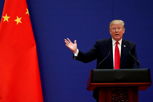 us president donald trump delivers his speech as he and china 039 s president xi jinping meet business leaders at the great hall of the people in beijing china november 9 2017 photo reuters