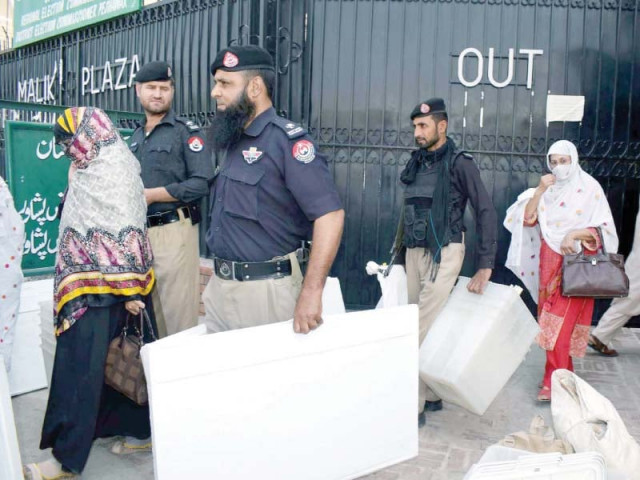 policemen help women election officials carry polling supplies to their respective polling stations a day ahead of by elections photos ppi policemen help women election officials carry polling supplies to their respective polling stations a day ahead of by elections photos ppi