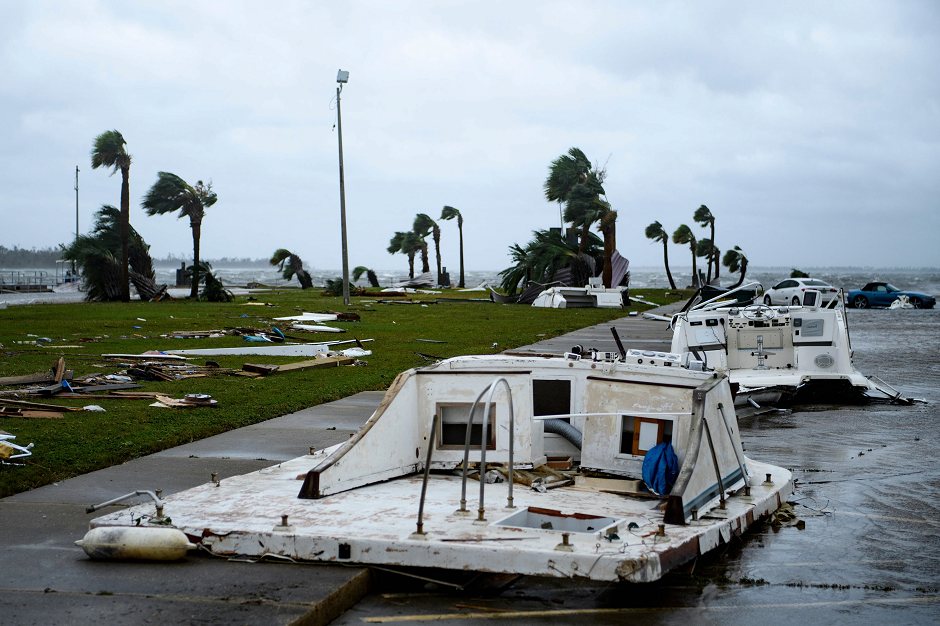 damaged boats and cars are seen in a marina after hurricane michael afp