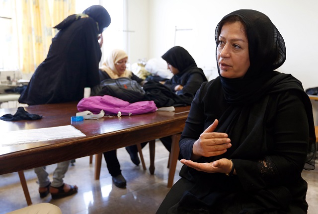 an iranian woman talks to afp correspondent at the ilia charity complex that caters to hundreds of struggling families and afghan refugees in the iranian capital of tehran on september 11 2018   this centre is run by the ilia foundation founded a decade ago by social workers and wealthy businessmen who have partnered with un refugee and health agencies to help around 1 000 families from deprived backgrounds photo afp