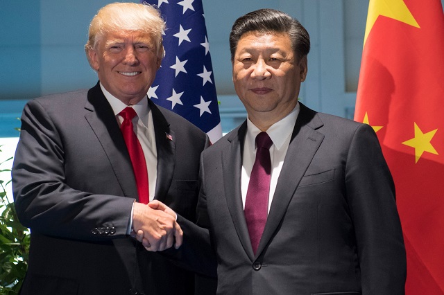 us president donald trump and chinese president xi jinping r shake hands prior to a meeting on the sidelines of the g20 summit in hamburg germany july 8 2017 photo afp