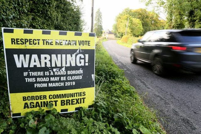 a sign near a road warns of brexit border controls in ireland photo afp a sign near a road warns of brexit border controls in ireland photo afp