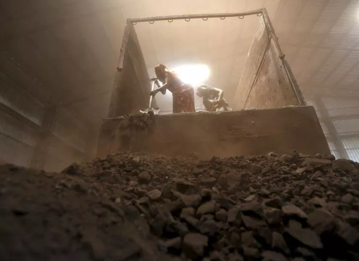 workers unload coal from a supply truck at a yard photo reuters workers unload coal from a supply truck at a yard photo reuters