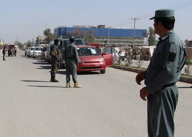 afghan policemen inspect vehicles at a checkpoint in helmand province afghanistan photo reuters afghan policemen inspect vehicles at a checkpoint in helmand province afghanistan photo reuters
