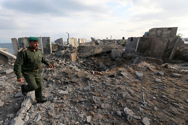 a member of palestinian security forces loyal to hamas inspects the scene of an israeli air strike in the southern gaza strip october 17 2018 photo reuters a member of palestinian security forces loyal to hamas inspects the scene of an israeli air strike in the southern gaza strip october 17 2018 photo reuters