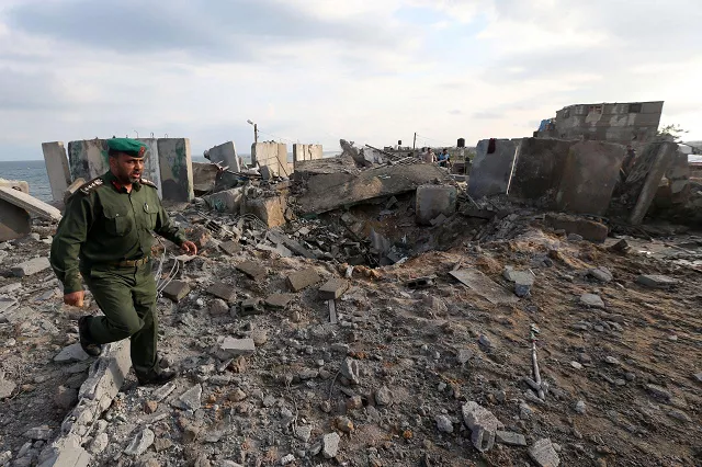 a member of palestinian security forces loyal to hamas inspects the scene of an israeli air strike in the southern gaza strip october 17 2018 photo reuters a member of palestinian security forces loyal to hamas inspects the scene of an israeli air strike in the southern gaza strip october 17 2018 photo reuters