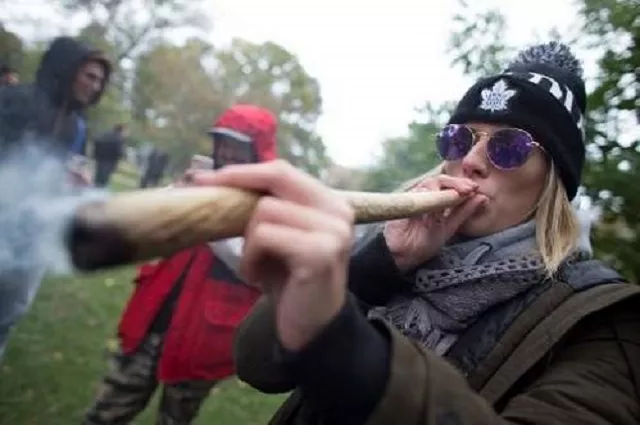 a woman puffs on legal weed during a legalisation party at trinity bellwoods park in toronto canada photo afp a woman puffs on legal weed during a legalisation party at trinity bellwoods park in toronto canada photo afp
