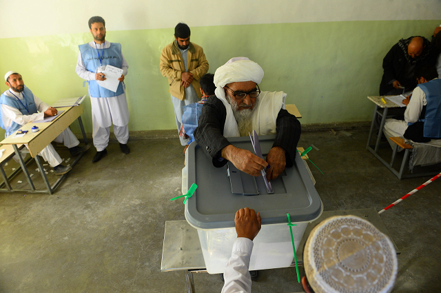 an afghan voter casts his ballot at a polling centre for the country 039 s legislative election in herat province photo afp