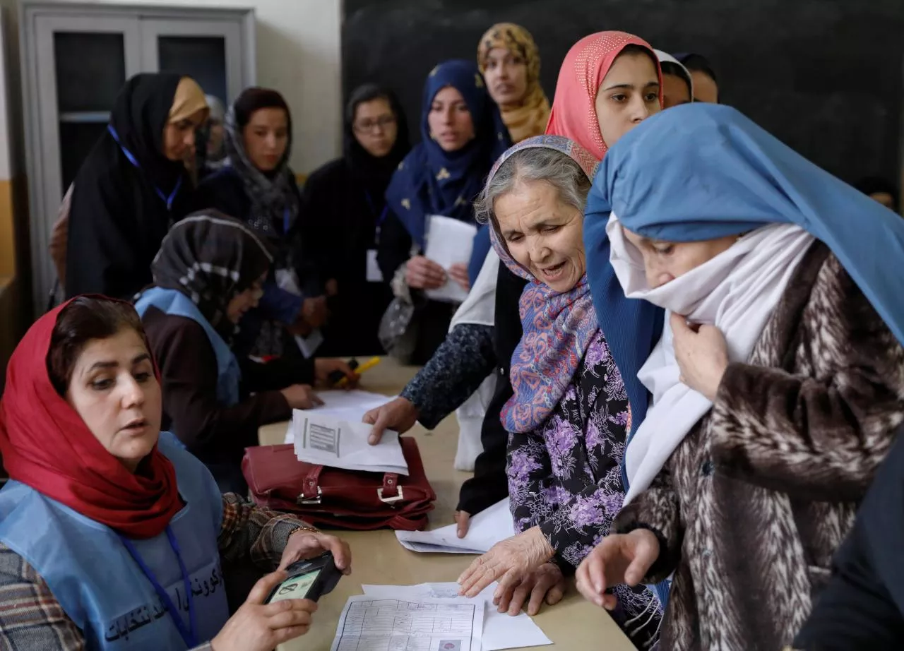 afghan women line up at a polling station during parliamentary elections in kabul afghanistan photo reuters afghan women line up at a polling station during parliamentary elections in kabul afghanistan photo reuters