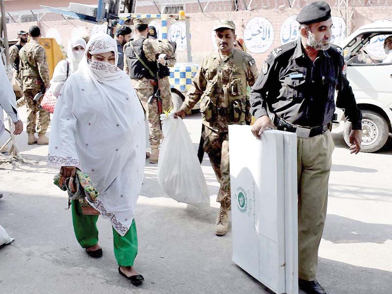 soldiers police and polling officials carry election material for the by polls in peshawar photo nni