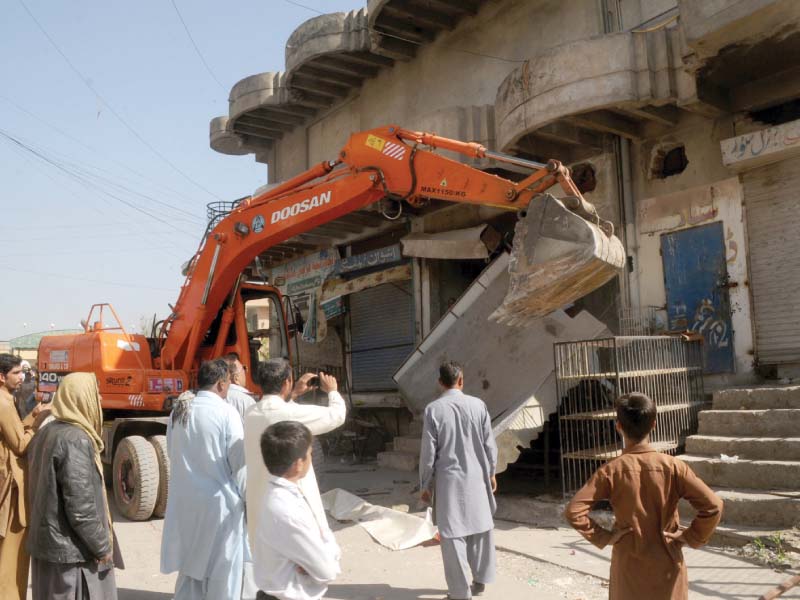 an excavator tears down an illegal building in rawalpindi photo agah mehroz express