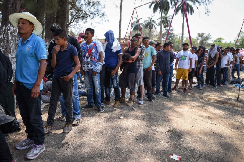 central american migrants stand at mexico 039 s border photo afp