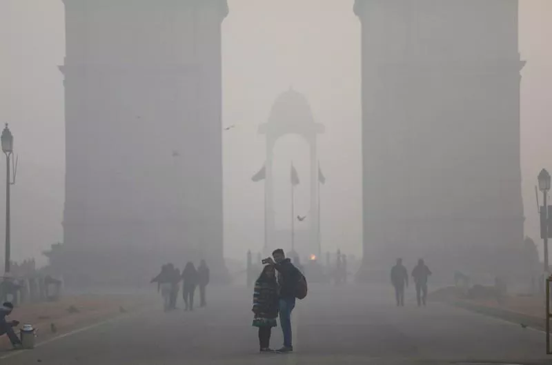 people take a selfie in front of the india gate war memorial on a smoggy winter morning in new delhi india december 26 2017 photo reuters people take a selfie in front of the india gate war memorial on a smoggy winter morning in new delhi india december 26 2017 photo reuters