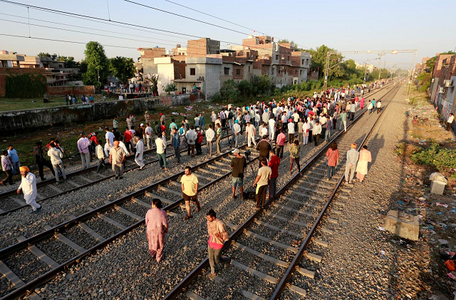 people gather at the site of an accident after a commuter train traveling at high speed ran through a crowd of people on the rail tracks on friday in amritsar india october 20 2018 photo reuters