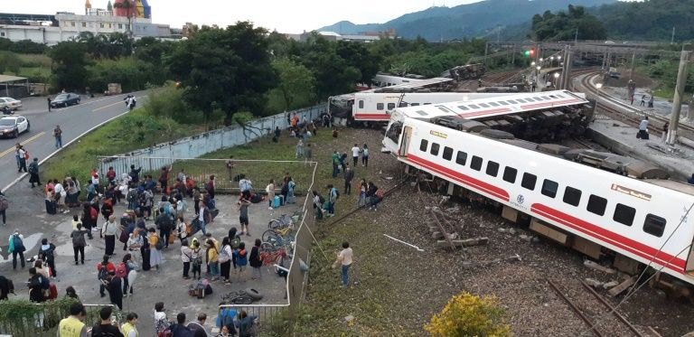 all eight carriages on the puyuma express train in taiwan were derailed and five flipped onto their side in the accident photo afp