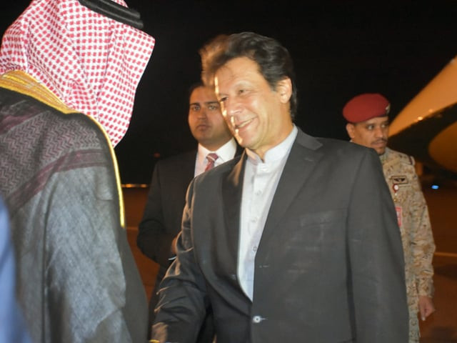 pm imran is being received at madina airport upon his arrival in saudi arabia on monday photo express pm imran is being received at madina airport upon his arrival in saudi arabia on monday photo express