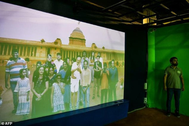 museum visitors are projected with independence icon mahatma gandhi on a screen using a chroma key effect photo afp museum visitors are projected with independence icon mahatma gandhi on a screen using a chroma key effect photo afp