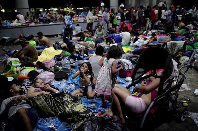migrants part of a caravan of thousands of migrants from central america en route to the united states rest along the sidewalks of tapachula city center mexico october 21 2018 photo reuters migrants part of a caravan of thousands of migrants from central america en route to the united states rest along the sidewalks of tapachula city center mexico october 21 2018 photo reuters