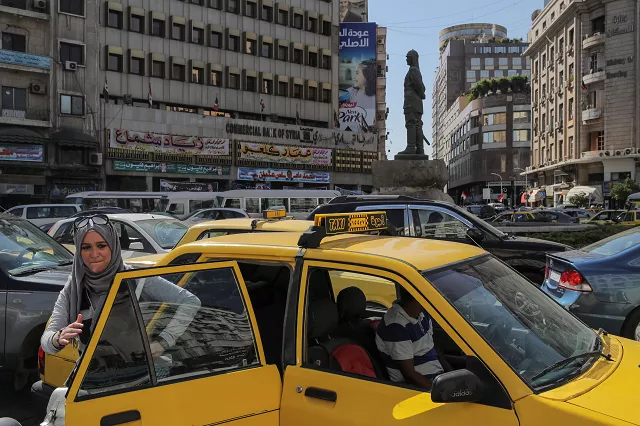 a woman exits a taxi during rush hour in central damascus syria september 16 2018 photo reuters a woman exits a taxi during rush hour in central damascus syria september 16 2018 photo reuters