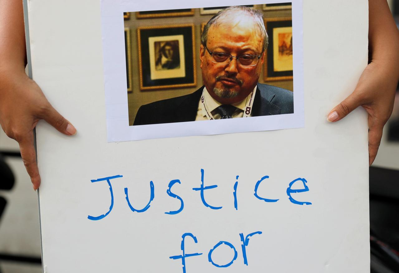 an indonesian journalist holds a placard during a protest over the disappearance of saudi journalist jamal khashoggi in front of the saudi arabia embassy in jakarta indonesia photo reuters