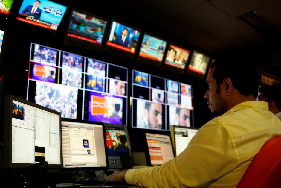 an employee works at the control room of a news television channel in karachi photo reuters