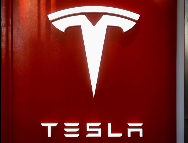 the tesla logo is seen at the entrance to tesla motors 039 new showroom in manhattan 039 s meatpacking district in new york city us december 14 2017 photo reuters