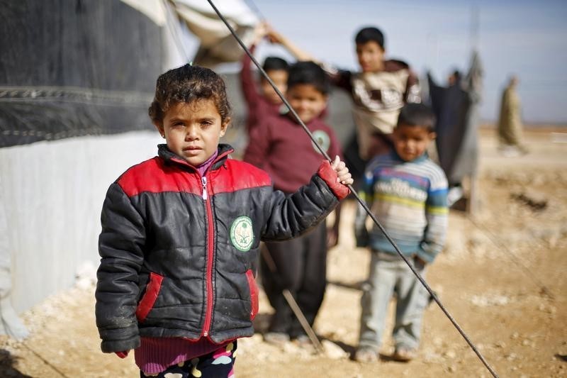 syrian refugee children pose as they play near their families 039 residence at al zaatari refugee camp in the jordanian city of mafraq near the border with syria january 30 2016 reuters muhammad hamed