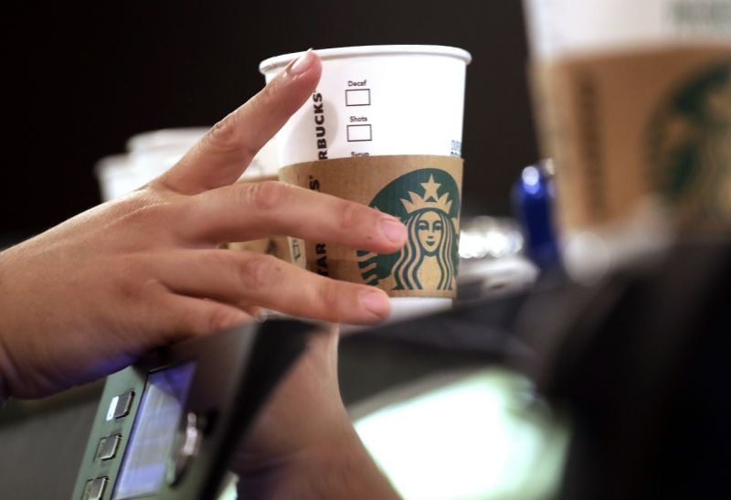 file   in this may 29 2018 file photo a barista reaches for an empty cup at a starbucks in the pike place market in seattle starbucks has opened its first u s signing store to better serve hard of hearing customers the store in washington d c is just blocks from galludet univerisity one of the nation s oldest universities serving deaf and hard of hearing students photo afp