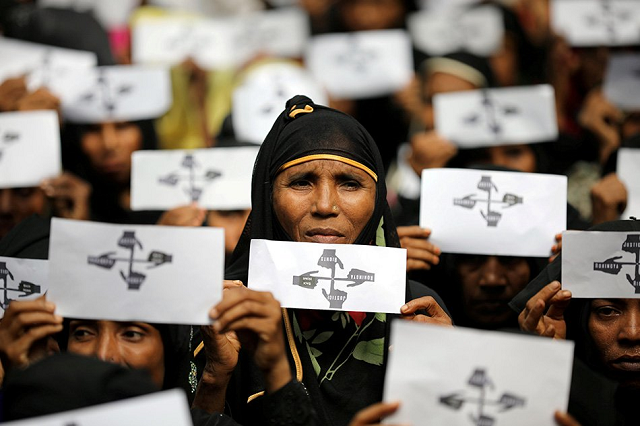 rohingya refugee women hold placards as they take part in a protest at the kutupalong refugee camp to mark the first anniversary of their exodus in cox 039 s bazar bangladesh august 25 2018 photo reuters