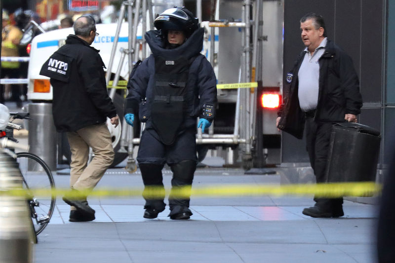 a member of the new york police department bomb squad is pictured outside the time warner center in the manhattan borough of new york city after a suspicious package was found inside the cnn headquarters in new york us photo reuters