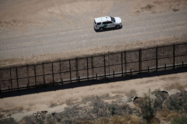 a us border patrol vehicle is seen along the us mexico border fence in tornillo texas photo afp a us border patrol vehicle is seen along the us mexico border fence in tornillo texas photo afp