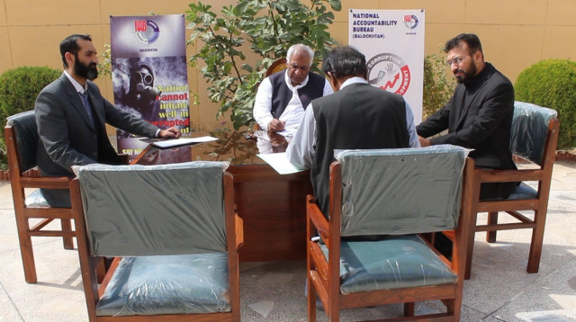 national accountability bureau director general muhammad abid javed listens to the complainants during an open court in quetta photo express