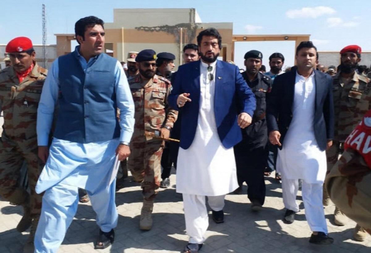 state minister for interior shehryar afridi and special assistant to the pm on overseas pakistanis zulfi bukhari along with their security detail arrive at pakistan house in taftan photo express