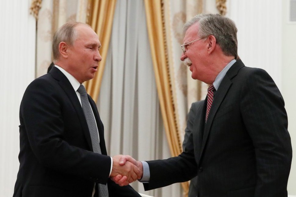 russian president vladimir putin l shakes hands with us national security adviser john bolton during a meeting at the kremlin in moscow russia photo reuters