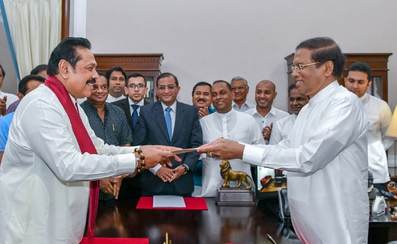 former sri lankan president mahinda rajapakse left is sworn is as prime minister by president maithripala sirisena in colombo after incumbent premier ranil wickremesinghe was sacked photo afp