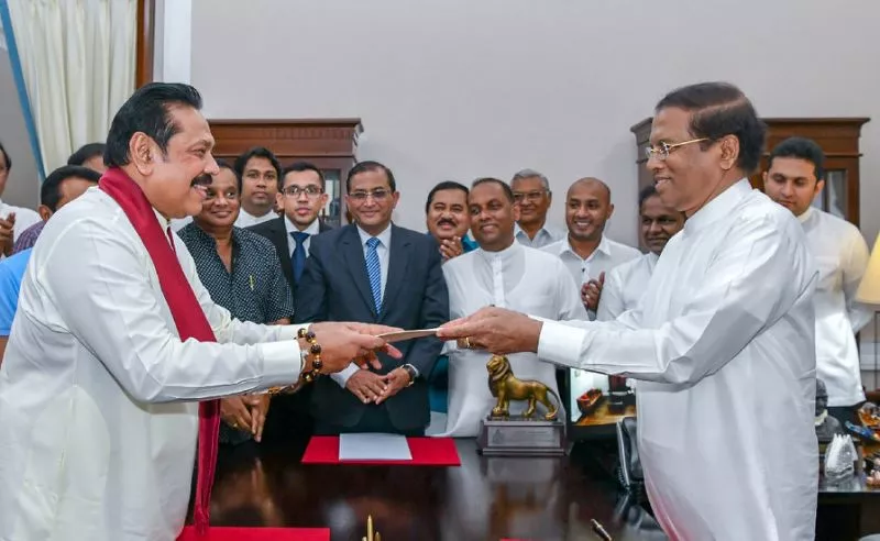 former sri lankan president mahinda rajapakse left is sworn is as prime minister by president maithripala sirisena in colombo after incumbent premier ranil wickremesinghe was sacked photo afp former sri lankan president mahinda rajapakse left is sworn is as prime minister by president maithripala sirisena in colombo after incumbent premier ranil wickremesinghe was sacked photo afp