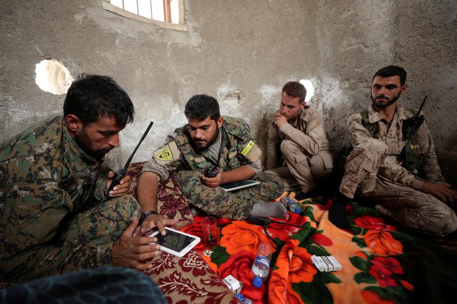 fighters from syrian democratic forces sdf sit together in raqqa syria september 25 2017 reuters rodi said