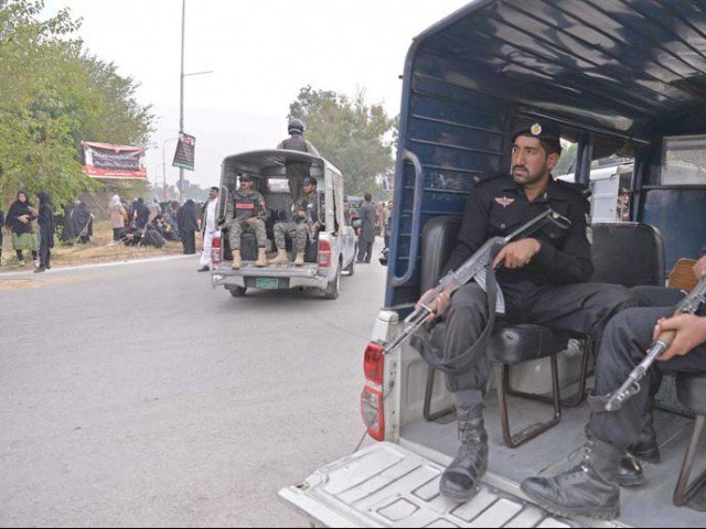 security personnel escort a chehlum procession in islamabad photo afp