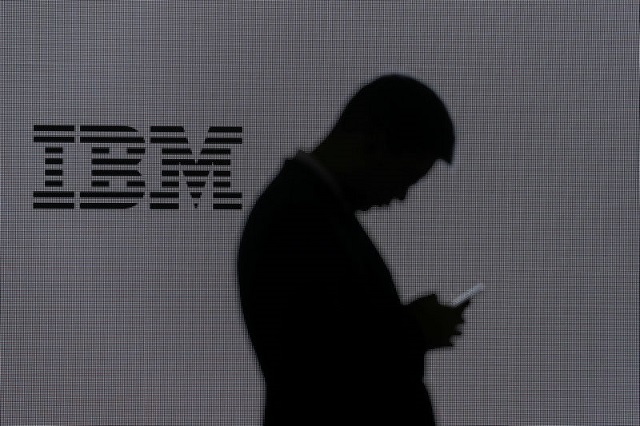 a man checks his mobile phone outside ibm 039 s booth at the mobile world congress in barcelona spain february 28 2018 photo reuters