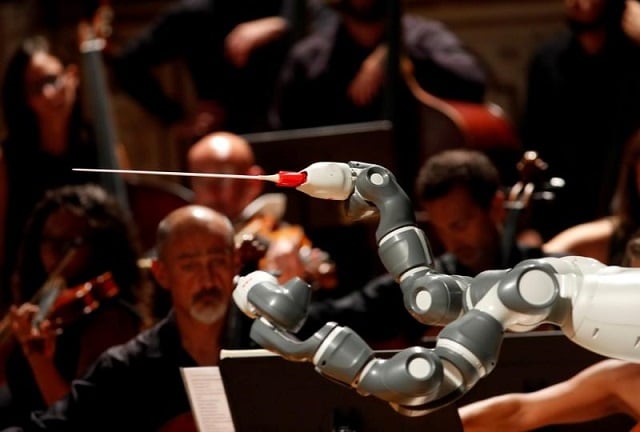 humanoid robot yumi conducts the lucca philharmonic orchestra performing a concert alongside italian tenor andrea bocelli unseen at the verdi theatre in pisa italy september 12 2017 photo reuters