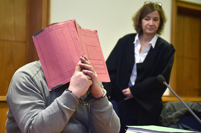in this file photo taken on february 26 2015 german former male nurse niels hoegel hides his face behind a folder as he waits next to his lawyer ulrike baumann r for the opening of another session of his trial at a court in oldenburg northwestern germany german nurse niels hoegel already serving a lengthy term for previous killings will go on trial before anguished relatives on october 30 2018 over the murders of around 100 more people a spree prosecutors say is unprecedented in the post war period photo afp in this file photo taken on february 26 2015 german former male nurse niels hoegel hides his face behind a folder as he waits next to his lawyer ulrike baumann r for the opening of another session of his trial at a court in oldenburg northwestern germany german nurse niels hoegel already serving a lengthy term for previous killings will go on trial before anguished relatives on october 30 2018 over the murders of around 100 more people a spree prosecutors say is unprecedented in the post war period photo afp
