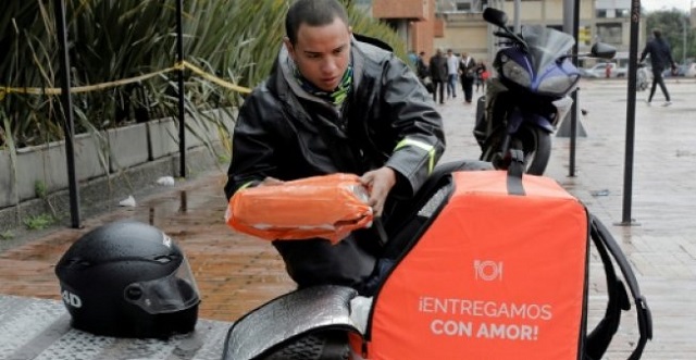 rappi couriers are easily identifiable by their orange bags and outfits but the company has distinguished itself by becoming colombia 039 s first unicorn photo afp