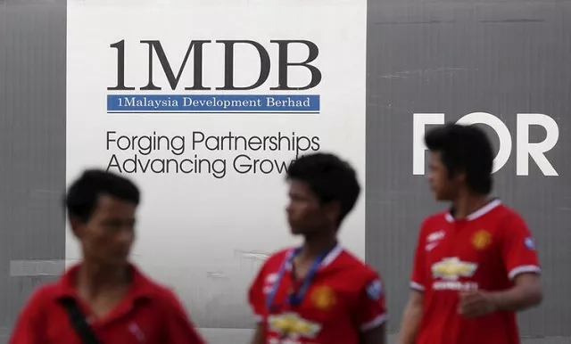 men walk past a 1malaysia development berhad 1mdb billboard at the fund 039 s flagship tun razak exchange development in kuala lumpur march 1 2015 reuters file men walk past a 1malaysia development berhad 1mdb billboard at the fund 039 s flagship tun razak exchange development in kuala lumpur march 1 2015 reuters file