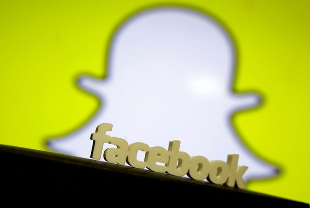 a 3d printed facebook logo is seen in front of a displayed snapchat logo in this picture illustration taken august 11 2017 photo reuters