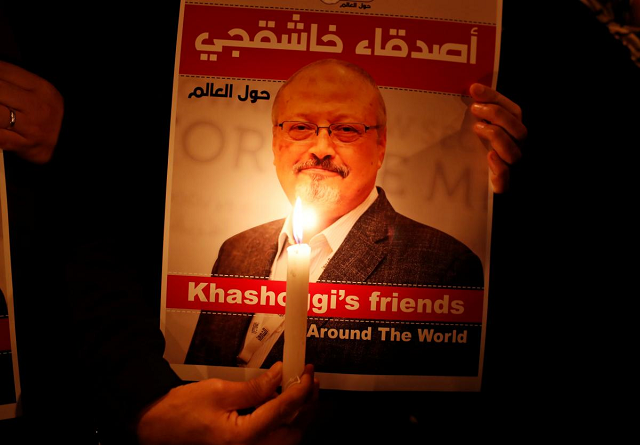 a demonstrator holds a poster with a picture of saudi journalist jamal khashoggi outside the saudi arabia consulate in istanbul turkey october 25 2018 photo reuters