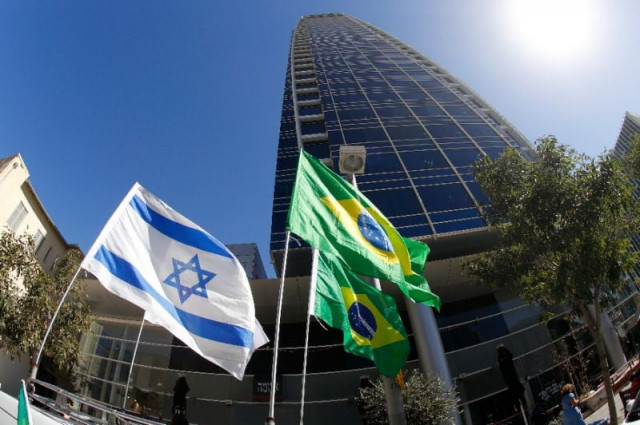 israeli and brazilian flags fly outside the brazilian embassy in the israeli city of tel aviv photo afp