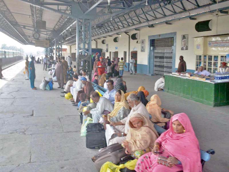 passengers wait at faisalabad railway station due to disruption in trains service photo online