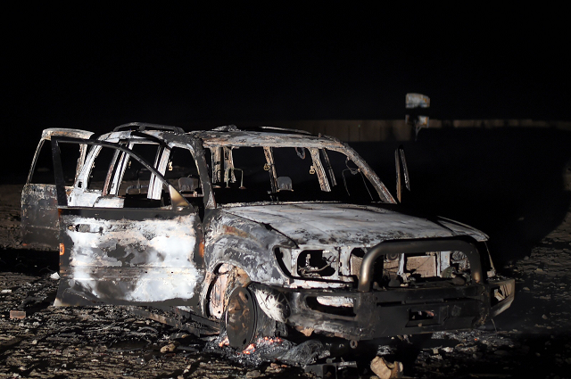 a picture taken on november 2 2018 shows the remains of a car reportedly used by the gunmen who attacked a bus carrying coptic christians on the side of a road in egypt 039 s southern minya province photo afp